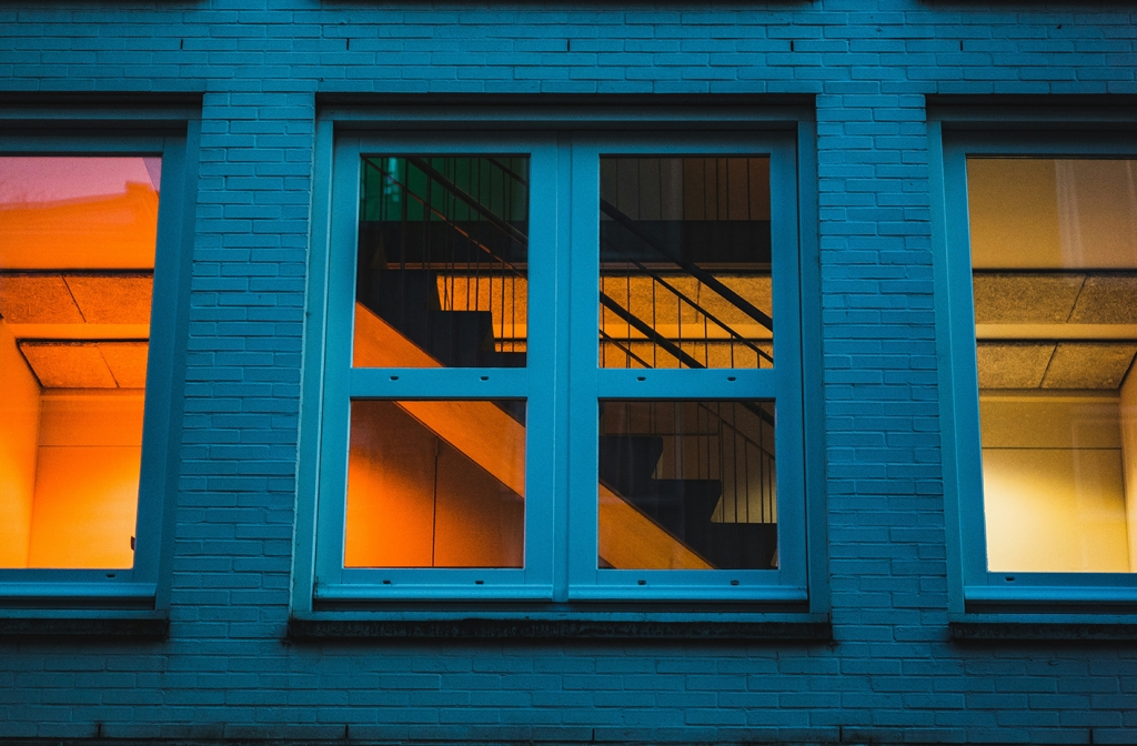 Light in windows. Photo by Ehud Neuhaus on Unsplash._0.jpg